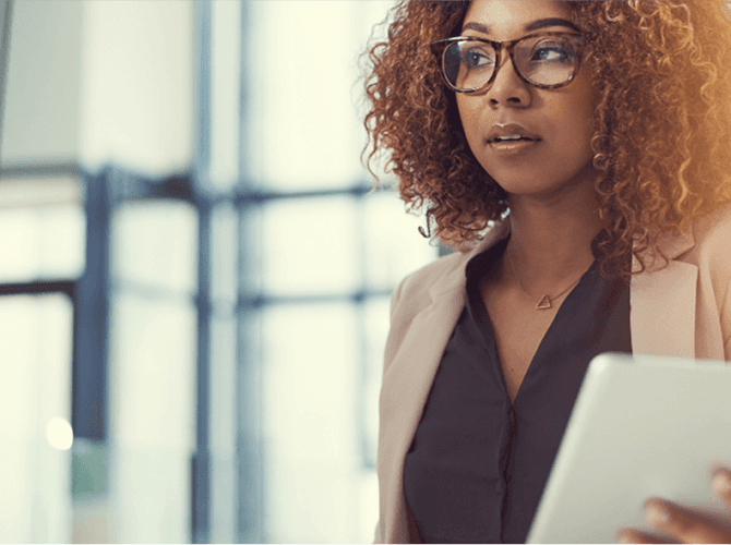 Professional woman looking through window